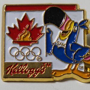 KELLOGG'S TOUCAN SAM OLYMPIC SPONSOR METAL LAPEL PIN WEAR CEREAL AD CARTOON